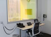 View of interview room from behind one way glass where professor can give instructions.